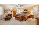Spacious main bedroom with neutral walls, a ceiling fan, and a comfortable bed with decorative pillows at 206 Lisa Dr, Carrboro, NC 27510