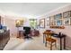 Bright home office with multiple workspaces, a comfortable chair, and fun decor at 206 Lisa Dr, Carrboro, NC 27510