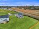 Aerial view of a newly constructed home featuring a large lawn and attractive landscaping at 21 Whistling Way # 17, Lillington, NC 27546