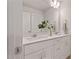 Bright bathroom featuring a double sink vanity with white cabinets and a large mirror at 21 Whistling Way # 17, Lillington, NC 27546