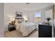 Well-lit bedroom features a comfortable bed, dresser, and a view from the window at 21 Whistling Way # 17, Lillington, NC 27546