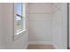 Bright walk-in closet with window and shelving providing ample storage at 21 Whistling Way # 17, Lillington, NC 27546