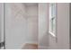 Organized walk-in closet with shelving and a window for natural light at 21 Whistling Way # 17, Lillington, NC 27546
