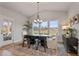 Bright dining room features large windows, modern chandelier, wood table, and stylish rug at 21 Whistling Way # 17, Lillington, NC 27546