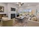 Cozy living room features a fireplace, large windows, and modern furnishings at 21 Whistling Way # 17, Lillington, NC 27546