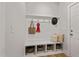 Mudroom offers built-in bench, storage cubbies, hooks, and decor to complete the space at 21 Whistling Way # 17, Lillington, NC 27546
