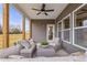 Inviting covered patio featuring wicker seating and a view of the expansive backyard at 21 Whistling Way # 17, Lillington, NC 27546