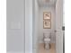 Clean toilet room with white fixtures and neutral-toned flooring and wall decor at 21 Whistling Way # 17, Lillington, NC 27546