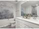 This bathroom features a double sink vanity with white cabinets and an oversized mirror at 2301 Edenberry Ln, Fuquay Varina, NC 27526