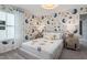 This bedroom features a decorative wallpaper, soft carpet, and a window that provides natural light at 2301 Edenberry Ln, Fuquay Varina, NC 27526