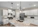 Gourmet kitchen featuring granite counters and stainless steel appliances at 2301 Edenberry Ln, Fuquay Varina, NC 27526