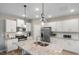 Gourmet kitchen featuring granite counters and stainless steel appliances at 2301 Edenberry Ln, Fuquay Varina, NC 27526