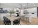 Open kitchen and dining area with stainless steel appliances and island at 2301 Edenberry Ln, Fuquay Varina, NC 27526
