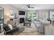 Inviting living room with fireplace, plush seating and plenty of natural light at 2301 Edenberry Ln, Fuquay Varina, NC 27526