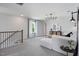 This loft features modern lighting, neutral carpet, and comfortable seating near a window at 2301 Edenberry Ln, Fuquay Varina, NC 27526