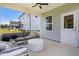 Covered patio with comfortable seating and views of the backyard, perfect for outdoor entertaining at 2301 Edenberry Ln, Fuquay Varina, NC 27526