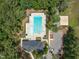 Overhead shot of the community pool and clubhouse in a serene wooded setting at 2626 Nassau Trce, Fuquay Varina, NC 27526