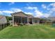Beautifully maintained backyard, screened-in porch, lush green lawn, and black metal fence for privacy at 2626 Nassau Trce, Fuquay Varina, NC 27526