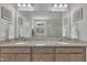 Bathroom featuring double sinks, granite countertops and walk-in shower at 2626 Nassau Trce, Fuquay Varina, NC 27526