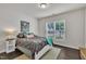 Bright bedroom with a large window, dark wood floors, and neutral paint at 2626 Nassau Trce, Fuquay Varina, NC 27526
