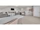 Versatile bonus room featuring neutral colors, lots of seating, and a dedicated workspace with a desk at 2626 Nassau Trce, Fuquay Varina, NC 27526