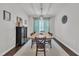 Classic dining room featuring a large wooden table, stylish lighting, and modern decor at 2626 Nassau Trce, Fuquay Varina, NC 27526
