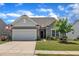Charming single-story home featuring a two-car garage, well-maintained lawn, and inviting curb appeal at 2626 Nassau Trce, Fuquay Varina, NC 27526