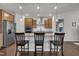 Modern kitchen featuring stainless steel appliances, granite countertops, and a stylish island with bar seating at 2626 Nassau Trce, Fuquay Varina, NC 27526