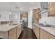 Spacious kitchen featuring updated stainless steel appliances, granite countertops, and ample cabinet space at 2626 Nassau Trce, Fuquay Varina, NC 27526