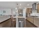 Stylish kitchen island with granite countertops, stainless steel appliances, and barstool seating at 2626 Nassau Trce, Fuquay Varina, NC 27526