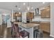 Modern kitchen featuring stainless steel appliances, granite countertops, and a stylish island with bar seating at 2626 Nassau Trce, Fuquay Varina, NC 27526