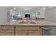 Modern kitchen with island sink, granite countertops, stainless appliances and open to the Gathering room at 2626 Nassau Trce, Fuquay Varina, NC 27526