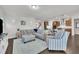 Comfortable living room with stylish furniture, wood floors, and an open view of the kitchen at 2626 Nassau Trce, Fuquay Varina, NC 27526