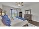 Bright main bedroom features large windows, dark wood floors, and neutral paint at 2626 Nassau Trce, Fuquay Varina, NC 27526