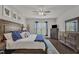Relaxing main bedroom with a plush bed, wood flooring, and a serene atmosphere with natural lighting at 2626 Nassau Trce, Fuquay Varina, NC 27526