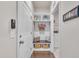 A tidy mudroom featuring built-in shelving, bench seating, and a convenient entryway to the laundry area at 2626 Nassau Trce, Fuquay Varina, NC 27526