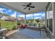 Relaxing screened-in porch with comfortable seating, ceiling fan, and view of the landscaped backyard at 2626 Nassau Trce, Fuquay Varina, NC 27526