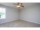 Bedroom featuring neutral carpet, ceiling fan and a large bright window at 2725 Gross Ave, Wake Forest, NC 27587