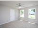 Bedroom featuring neutral walls, carpet, a ceiling fan and dual bright windows at 2725 Gross Ave, Wake Forest, NC 27587