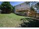 View of the back of the house, deck, patio and grassy backyard at 2725 Gross Ave, Wake Forest, NC 27587