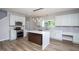 Bright kitchen with white cabinets, stainless appliances, and a large island at 2725 Gross Ave, Wake Forest, NC 27587