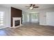 Cozy living room features a fireplace, windows, and modern flooring at 2725 Gross Ave, Wake Forest, NC 27587