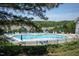 Community swimming pool with lots of lounge chairs at 2725 Gross Ave, Wake Forest, NC 27587