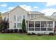 Expansive backyard featuring a screened porch, mature trees, and lush landscaping at 2941 Grandview Heights Lane Ln, Raleigh, NC 27614
