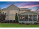 Expansive backyard featuring a screened porch, mature trees, and lush landscaping at 2941 Grandview Heights Lane Ln, Raleigh, NC 27614