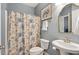 Comfortable bathroom featuring a shower-tub combination, a toilet, and a small sink at 2941 Grandview Heights Lane Ln, Raleigh, NC 27614