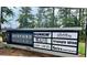 Community sign for Bedford Village featuring retail shops, cafes, services, and a fitness center in Wake Forest, NC at 2941 Grandview Heights Lane Ln, Raleigh, NC 27614