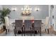Elegant dining room with a chandelier, patterned chairs, and a decorative mirror, perfect for formal entertaining at 2941 Grandview Heights Lane Ln, Raleigh, NC 27614