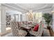 Spacious dining room with a large table, chandelier, and access to the living area, perfect for Gathering gatherings at 2941 Grandview Heights Lane Ln, Raleigh, NC 27614