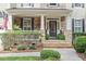 Inviting front porch with stone accents, manicured landscaping, and a welcoming entrance with clear address numbers at 2941 Grandview Heights Lane Ln, Raleigh, NC 27614